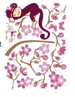 Monkey sleeping in pink blossom tree